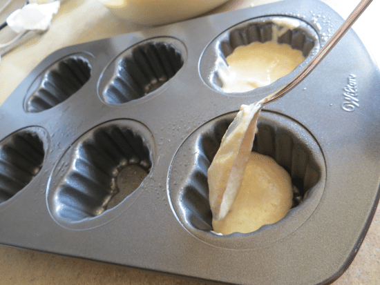 spooning batter whole wheat cupcakes