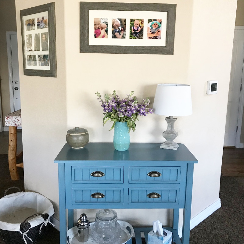 Blue Table with Pictures and Flowers