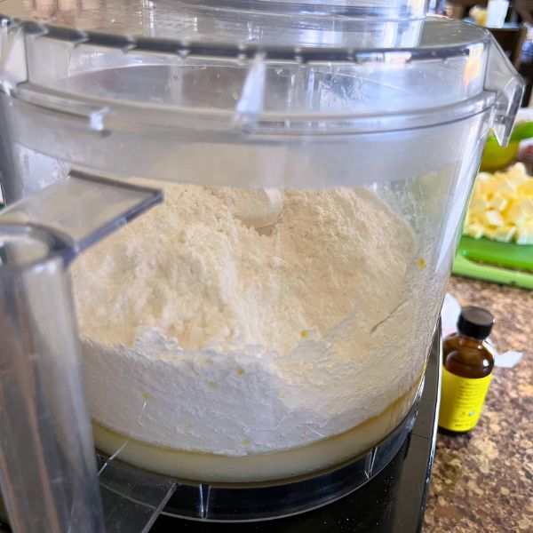 Lemon juice and egg yolk is added to the flour.